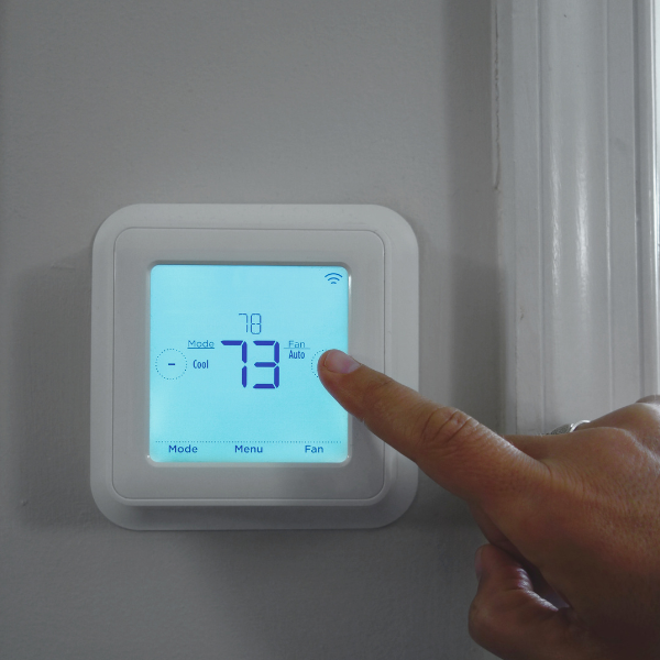 rising utility costs; thermostat displaying temperature